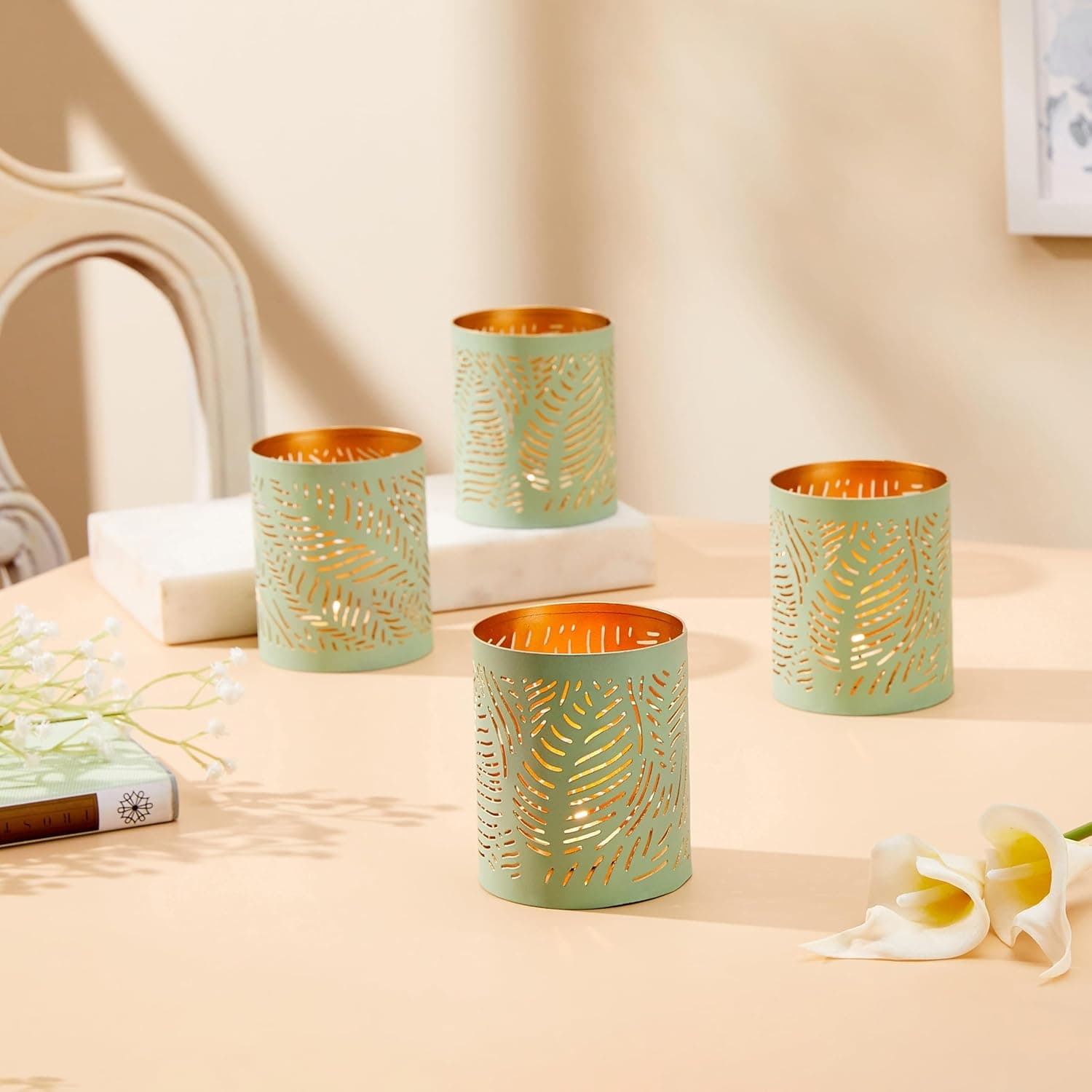 Amazon Brand - Solimo Tea Light Votive – Round Leaf Design, Sea Green Iron with Gold Interior, Set of 4 (Size: L-7.5 cm x W-7.5 cm x H-10 cm) at ₹150 (83% Off) – Amazon